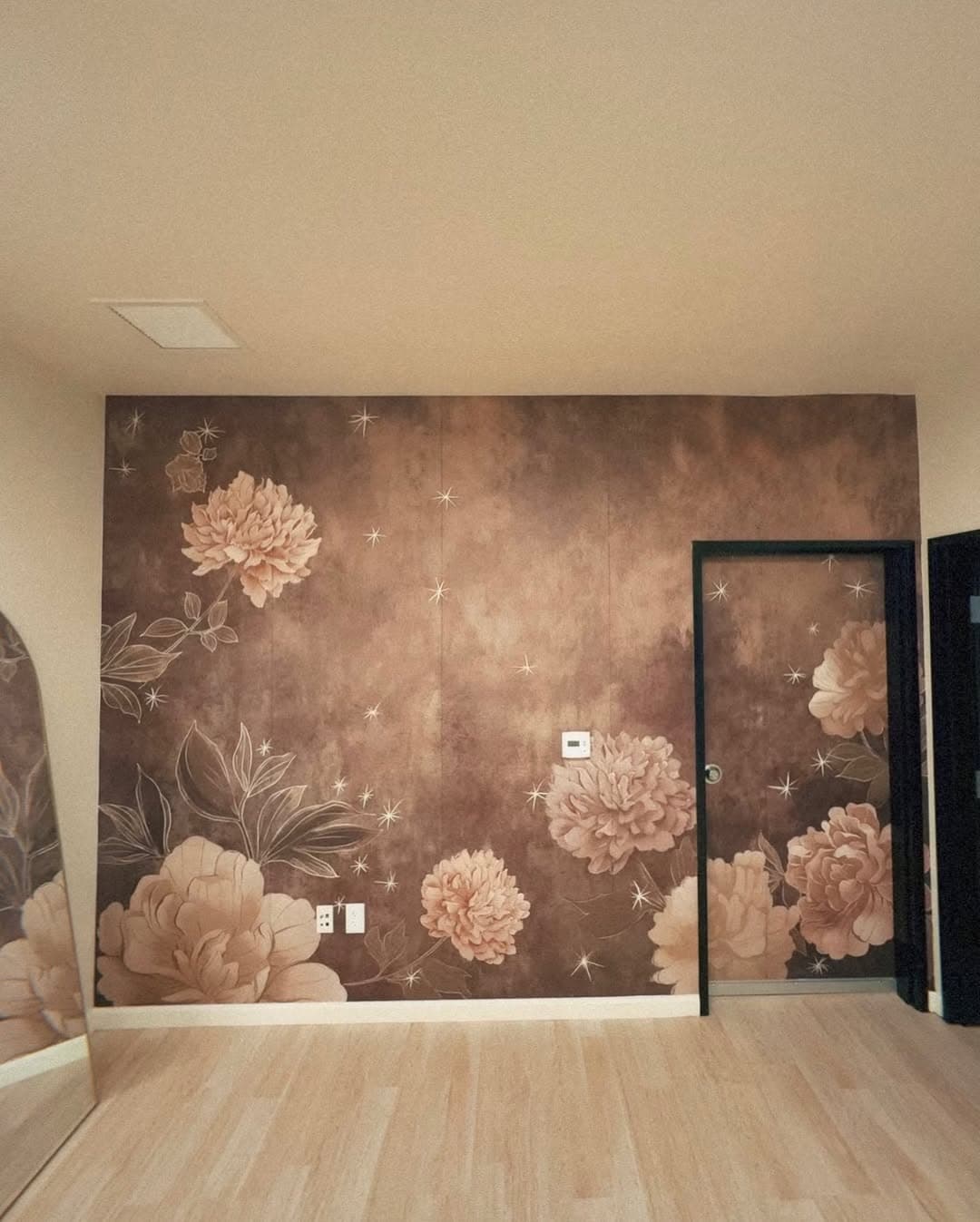 Romantic peony wall mural in bronze tones for wedding venue